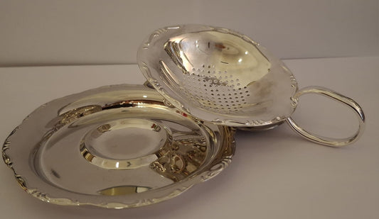 Silver colander and saucer